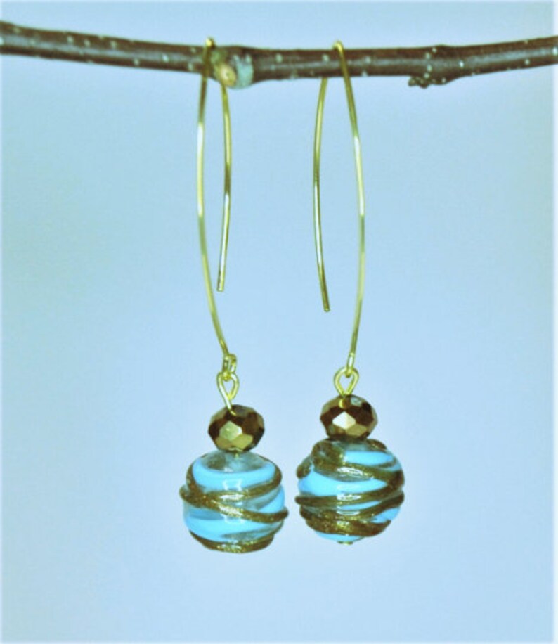 Blue and gold murano glass earrings Curved wire earrings