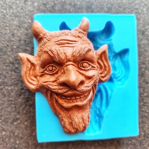 Mocking devil's head Silicone Mold (11x8.5x3.2cm), for the production of repetitions of hand-made sculptures