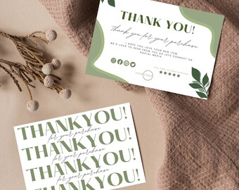 May include: A white card with the text "THANK YOU!" repeated four times in a green font. The text "for your purchase" is written in a smaller font below each "THANK YOU!" The card has a green and white background with a leaf design.