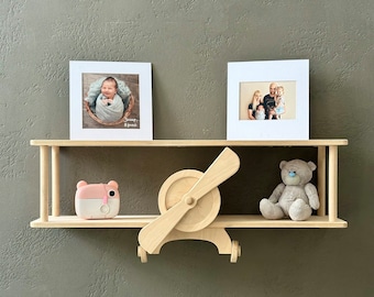 Plane bookshelf in baby room, wall nursery shelving, aviation baby room decor, hanging bookshelf for kids