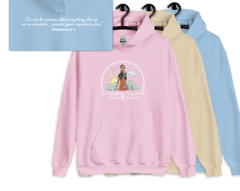 Moletom com capuz Santa Dimpna com versículo bíblico nas costas, Filipenses 4:6-8, para ansiedade, terapeutas, cuidadores, católicos, nas cores rosa, azul ou bege.