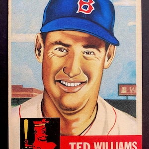 May include: A vintage baseball card depicting Ted Williams of the Boston Red Sox. The card shows a smiling portrait of Williams wearing a blue cap with a red "B". The card also includes the Red Sox logo and text identifying him as an outfielder.