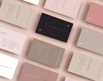 May include: A collection of business cards with a minimalist design. The cards are in various colors, including beige, pink, and black. The text on the cards includes the name "JOANNA THOMAS" and the phrase "BUSINESS NAME".