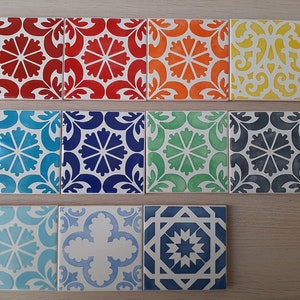 May include: Ten ceramic tiles with various geometric patterns in blue, green, red, yellow, and white. The tiles are arranged in two rows of five.