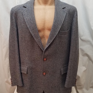 May include: A handmade wooden sign with the text "Welcome" in a playful font. The sign features a distressed white background and a dark brown frame, perfect for a front door or entryway. The sign measures approximately 12 inches wide and 6 inches tall.