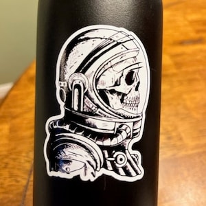 Fun Vinyl Sticker- Skeleton Astronaut. Waterproof & Laminated. Sticker Decal for Water Bottles, Laptop, Car. Upgraded Shipping on 5+ ordered