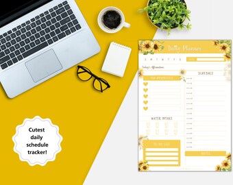 Puede incluir: Un planificador diario imprimible con un diseño de girasol. El planificador incluye secciones para la afirmación del día, las prioridades principales, el horario, la ingesta de agua, la lista de tareas pendientes y las notas.