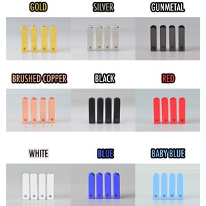 May include: A set of ten small metal rectangular bars in various colors, including gold, silver, gunmetal, brushed copper, black, red, white, blue, and baby blue. Each bar has a small screw on the top.