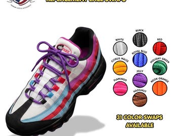 May include: Thin round replacement shoelaces in purple, shown on a white, black, blue, and red sneaker. The image displays a color chart with white, black, red, citrus maize, royal blue, holiday green, jelly, flamingo, neon orange, and hazelnut options.
