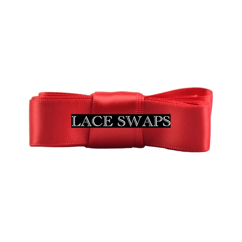 May include: A bright red satin ribbon folded into a bow shape with a smooth, reflective texture. The text LACE SWAPS is printed in a white serif font across the center of the ribbon, which is horizontally oriented against a plain background.