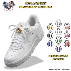 May include: A white sneaker featuring a gold metal lace lock on the laces. The image displays text reading METAL LACE LOCK, REPLACEMENT LACE LOCKS, and 32 COLOR SWAPS AVAILABLE, alongside a color chart showing gold, silver, rose gold, white, black, red, light green, blue, orange, and grape options.