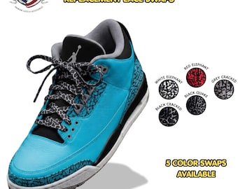 May include: Flat elephant print replacement shoelaces featuring a grey and black pattern. The product is displayed on a bright blue sneaker. Five color options are shown: white elephant, red elephant, grey cracked, black cracked, and black quake.
