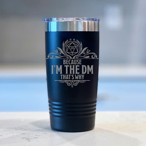 May include: Black stainless steel tumbler with a white engraved design featuring a 20-sided die and the text "Because I'm the DM That's Why".
