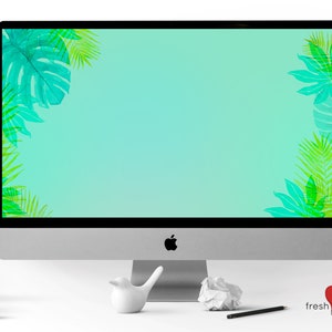 May include: A computer monitor with a light blue background and green tropical leaf designs on the corners. The monitor is on a white desk with a white bird figurine, a crumpled piece of paper, and a pencil.