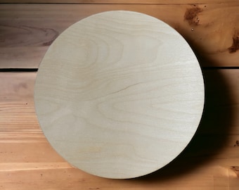 May include: A round, light wood plate with a smooth surface. The plate is perfect for serving food or displaying decorative items.