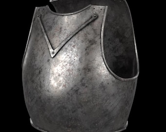 May include: A dark grey metal breastplate featuring a weathered, textured finish. The armor piece has a V-shaped reinforcement bar across the upper chest, a curved neckline, and large arm openings, presenting a sturdy, metallic construction.