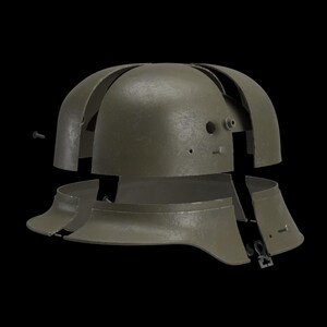 May include: An olive-drab metal helmet, disassembled, with multiple curved plates and a neck guard. The helmet's components are separated, revealing the internal structure and fastening hardware. The background is black.