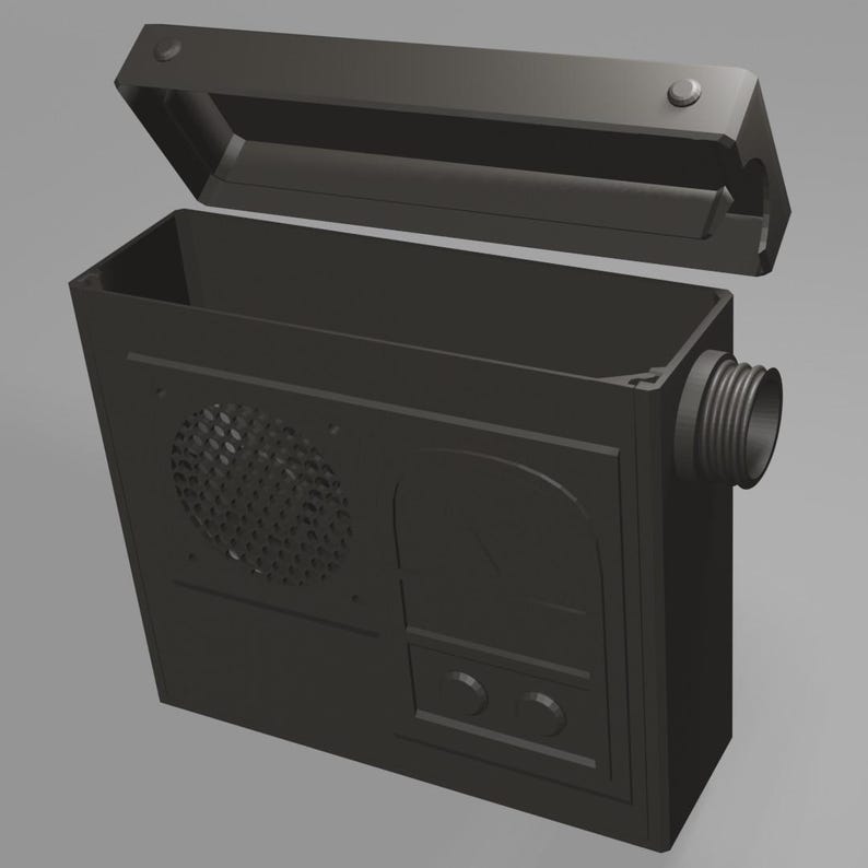 May include: A black, rectangular, electronic device with a speaker grille, a dial, and two buttons. The device has a removable top.