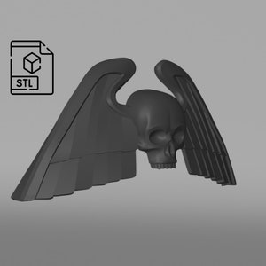 May include: A 3D printed model of a skull with wings. The skull is black and has a detailed design. The wings are also black and have a textured surface.