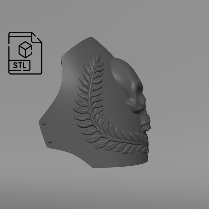 May include: A gray, 3D-rendered skull design with a laurel wreath and rivets. The image includes an STL file icon, suggesting a digital model for 3D printing. The design is likely for decorative or artistic purposes.