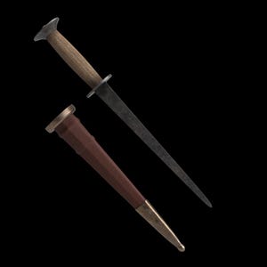 May include: A medieval-style dagger with a wooden handle and a dark, pointed blade. The dagger is accompanied by a brown leather sheath with brass accents. The handle is light brown, and the blade is dark gray.