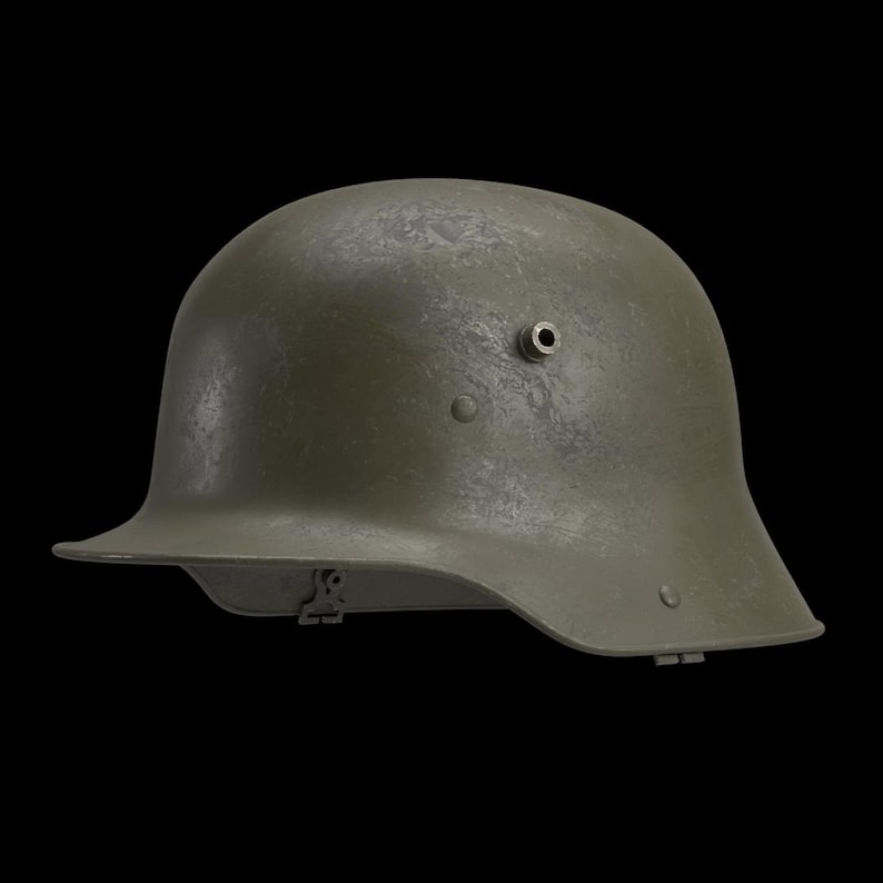 May include: An olive-green military helmet with a rounded top and a brim that curves around the face. The helmet has a textured surface and a small hole on the side. The background is black.