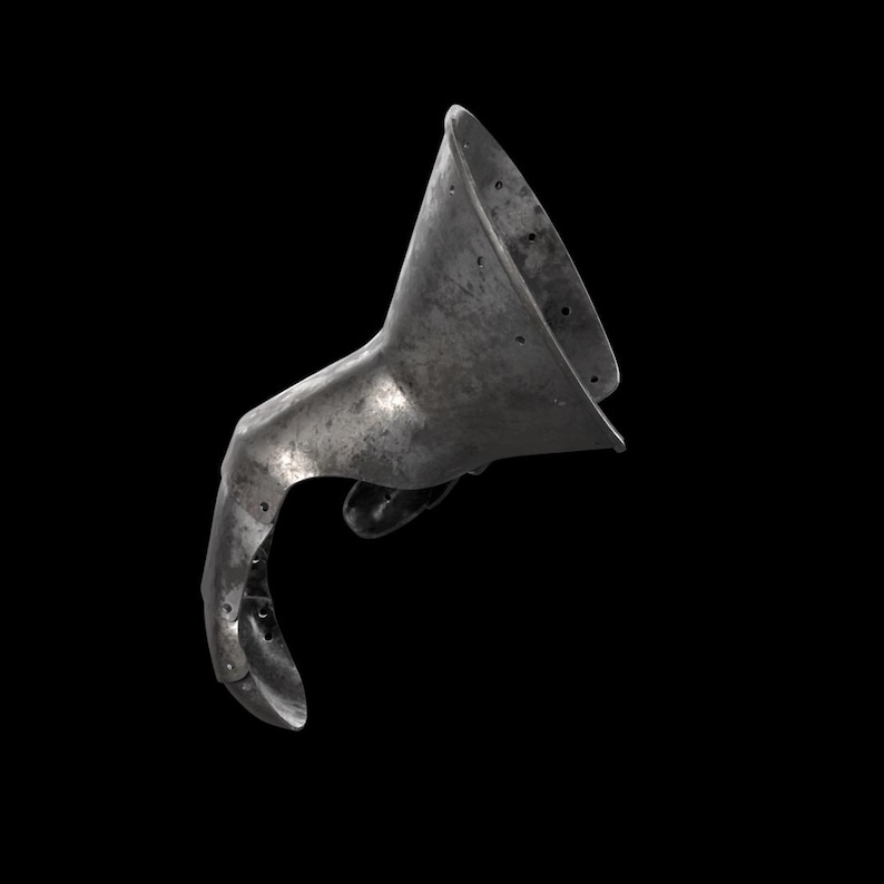 May include: A metallic gauntlet piece featuring a wide, flared cuff and a curved, articulated finger section. The surface has a weathered, dark grey finish with visible rivets along the edges, showing a historical design for hand protection.