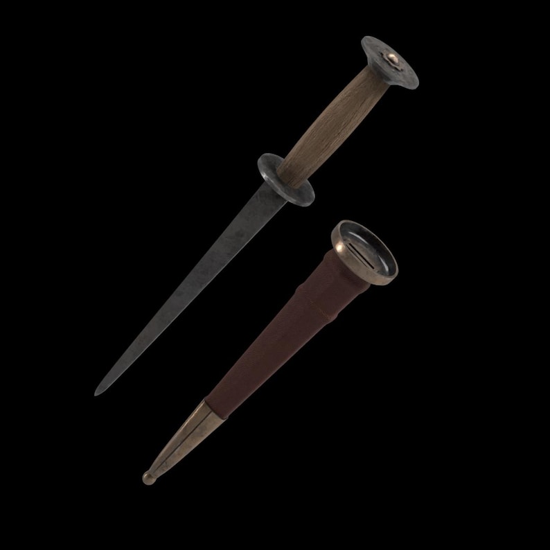May include: A medieval-style dagger with a wooden handle and a dark, pointed blade. The dagger is shown with its brown leather sheath, which has metal accents. The handle has a circular guard.