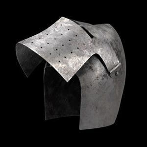 May include: A weathered, steel helmet with a distinctive visor featuring small ventilation holes. The helmet's design includes a curved top and a riveted side piece, suggesting historical or medieval origins. The metal has a worn, aged appearance.