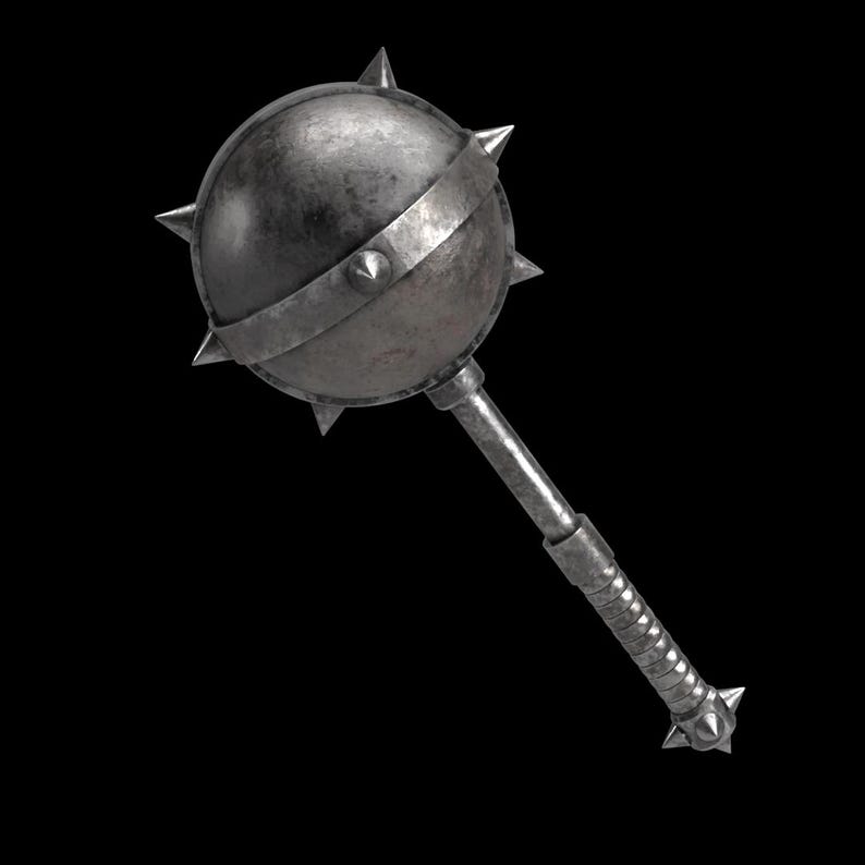 May include: A medieval-style mace with a spiked ball head and a textured handle. The mace is made of metal and has a weathered, antique appearance. The design includes a band around the head and a spiked end on the handle.