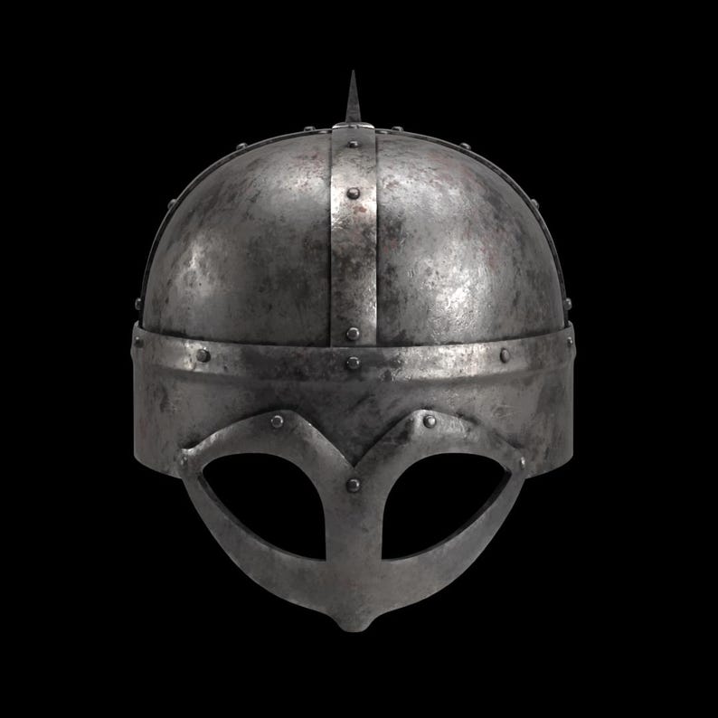 May include: A weathered, metallic Viking helmet with a prominent brow guard and a central spike. The helmet features riveted construction and a band around the base, suggesting historical craftsmanship. The design includes eye openings and a nose guard.
