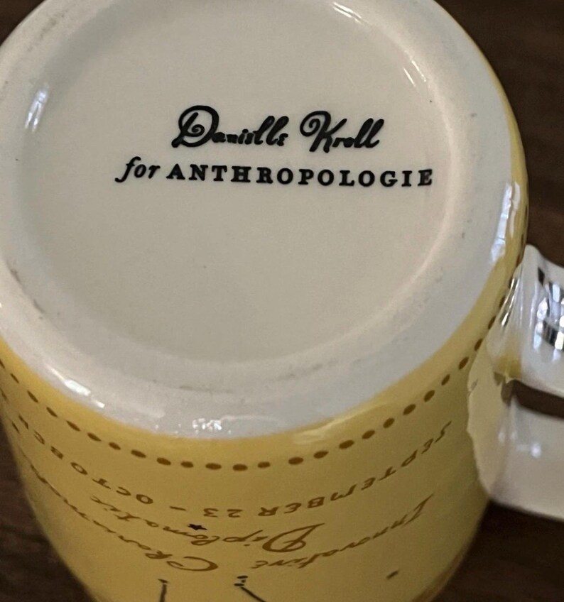 May include: A set of three ceramic mugs with a speckled, matte finish. The mugs are in shades of cream, light gray, and dark gray. Each mug has a simple, minimalist design, perfect for coffee or tea.