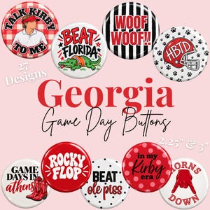 May include: A collection of round pin-back buttons featuring various sports-themed graphics and text including Talk Kirby To Me, Beat Florida, Woof Woof, HBTD, Game Days In Athens, Rocky Flop, Beat Ole Piss, In My Kirby Era, and Horns Down.