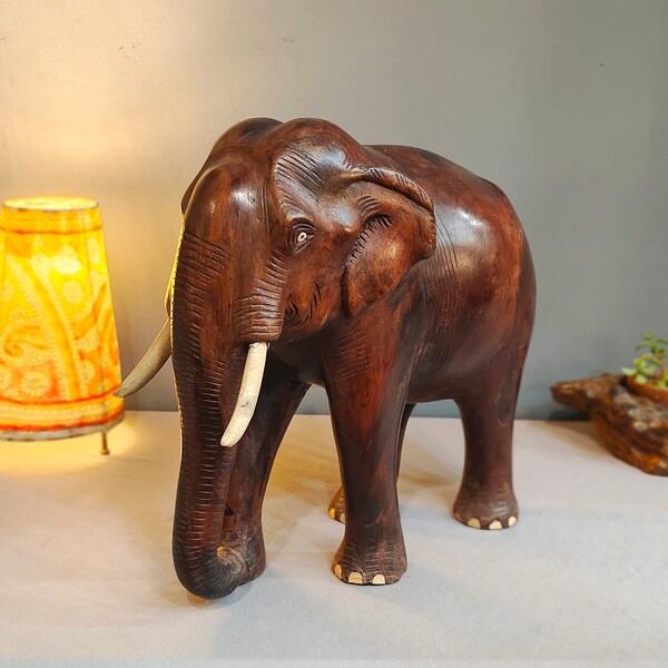 Indian Rosewood Elephant.Exquisitely hand carved from a single piece of wood. Beautiful originality shape and anatomy from Kerala.