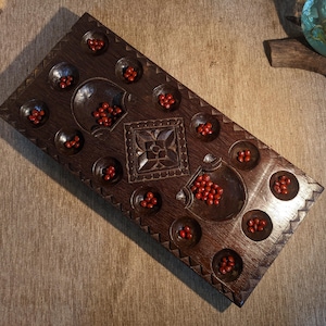 Pallankuli Antique Indian Game board Pallankuzhi Alagulimanae Mancala Vamana Guntalu with Manjadee seeds. Handcrafted in wood from Kerala.
