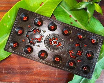 Ancient Indian Wooden Pallankuzhi Game Board with Seeds