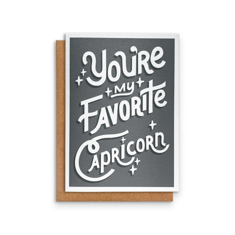 May include: A grey card with white text that reads "You're my favourite Capricorn".