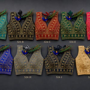 May include: A collection of ten intricately embroidered sleeveless tops in various colors, including teal, black, red, green, pink, blue, gray, navy, and gold. Each top features a deep V-neck and is adorned with detailed patterns and embellishments. The style numbers are visible.