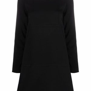 May include: A black long-sleeved dress with a round neckline and a multicolored trim. The dress has a slightly flared skirt and a zipper closure in the back.