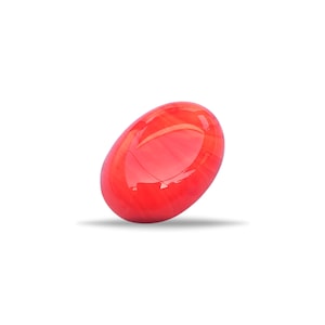 May include: A vibrant red, oval-shaped decorative object. The smooth, glossy surface reflects light, creating highlights and shadows. The object is set against a clean white background, emphasizing its form and color.