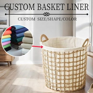 May include: A beige woven basket liner with a white fabric liner. The basket liner is sitting on a wooden floor. The text "CUSTOM BASKET LINER" and "CUSTOM SIZE/SHAPE/COLOR" is displayed above the basket. A close-up of a variety of fabric swatches is shown in the lower left corner of the image.