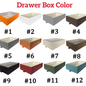 May include: Twelve different color options for drawer boxes. The boxes are made of a material that looks like leather and have a light beige interior. The colors are orange, white, gray, brown, dark gray, orange, beige, brown, black, red, green, and blue.