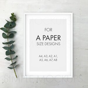 May include: White picture frame mockup with a white mat and a text overlay that reads "FOR A PAPER SIZE DESIGNS A4, A3, A2, A1, A5, A6, A7, A8". A sprig of eucalyptus is to the left of the frame.