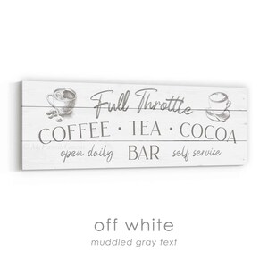 May include: Off-white wooden sign with the text "Full Throttle" and the words "COFFEE TEA COCOA" in grey. The sign also includes the phrases "open daily BAR self service" and illustrations of coffee cups.