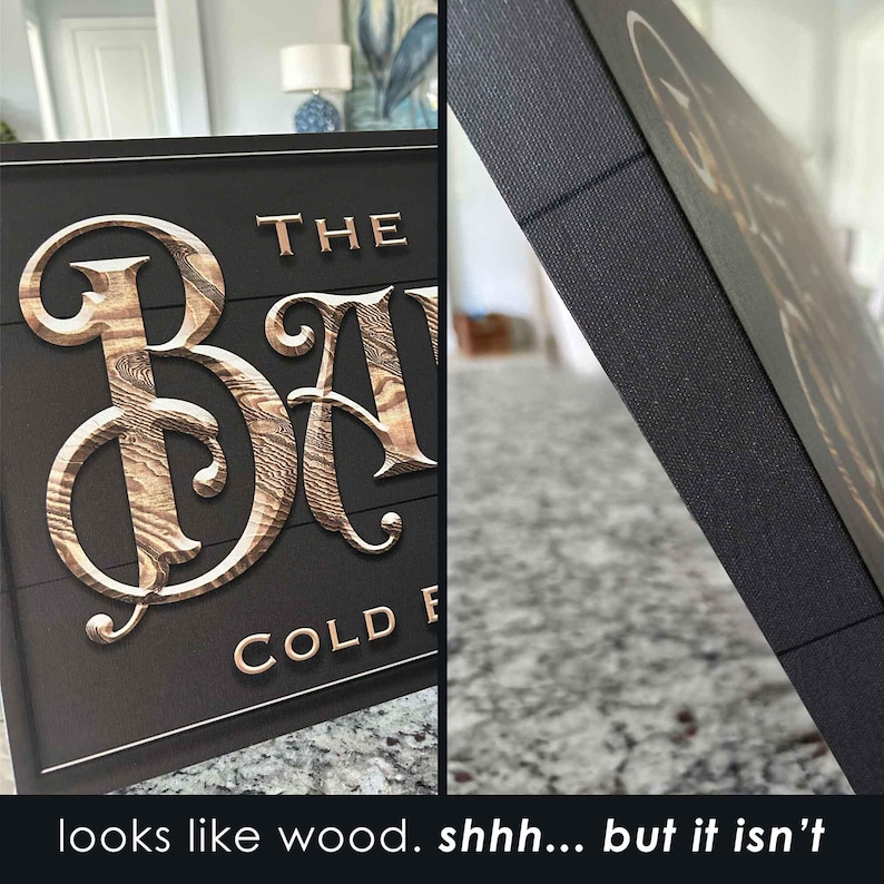 K&ouml;nnte beinhalten: Ein schwarzes Schild mit den Worten "The Barn" in goldenen Buchstaben mit einer Holzmaserung. Das Schild tr&auml;gt au&szlig;erdem den Schriftzug "Cold Fresh" in kleineren goldenen Buchstaben. Das Schild ist aus einem Material gefertigt, das wie Holz aussieht, aber keines ist.