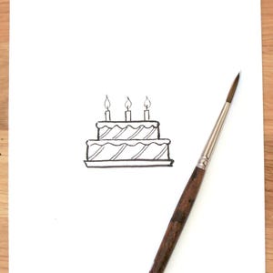 Dessin à l'encre d'un icône gâteau d'anniversaire noir et blanc