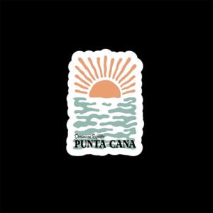 May include: A sticker featuring a sunset over the ocean with the text "Punta Cana". The design includes an orange sun, blue-green water, and the words "Dominican Republic" above "Punta Cana". The sticker has a white border and is set against a black background.