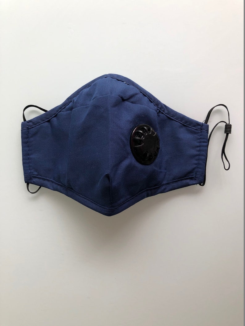 May include: A dark blue face mask with a black valve. The mask has elastic ear loops.