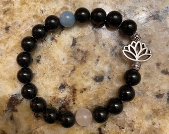 Black tourmaline Protection 8mm bracelet with rose quartz and aquamarine accents that increase fearlessness with silver lotus flower