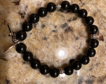 Black tourmaline protection and grounding bracelet with Miraculous Mary medal charm and cross with  silver cross. 8mm bead